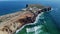 4K aerial view ocean waves rocky, cliffs Sagres Fortress At Sagres Point In Algarve Portugal 25 april 2023