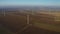 4K Aerial view over an eolian turbine wind farm. Green energy made from the wind