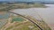 4K on Aerial view of railroad tracks for travel train parked with floating railway bridge