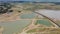 4K on Aerial view of railroad tracks for travel train parked with floating railway bridge