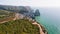 4K Aerial view of rocky cliff coastline near Praia da Ursa beach and Cabo da Roca located on Atlantic coast in Sintra