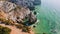 4K Aerial view of rocky cliff coastline near Praia da Ursa beach and Cabo da Roca located on Atlantic coast in Sintra