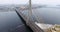 4K Aerial winter view of cable-stayed bridge over Daugava river in Riga Latvia. Vansu Bridge.