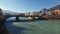 4K. Amazing Innsbruck in Austria, panoramic city view with Inn river, bridge and Alps. Winter time