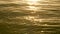 4K amazing sunset over the tropical beach. ocean beach waves on beach at sunset time , sunlight reflect on water surface.