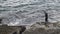 4k Asian Fisherman Wearing neoprene in coast rock for practice Free Diver