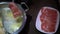 4K, Asian woman using chopsticks for cooking a meat in chinese hotpot soup