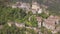 4k backwards aerial of abandoned village atop mountains, Laino Castello, Italy