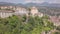 4k backwards aerial of abandoned village atop mountains, Laino Castello, Italy