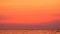 4K. beautiful twilight sky with dark orange color after sunset over the sea at tropical beach