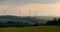 4K Beautiful windmill turbines, wind energy silhouetted in the sunset.