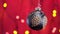 4k. Black New year ball toy and Blinking Garland with round defocused lights