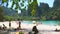 4k blurred out of focus footage of people relaxing on white sand ocean beach. Perfect tranquil background or backdrop