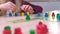 4k Board game and kids leisure concept - kids playing wood chips people figure in children table top game at home
