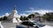 4k busy traffic & pedestrian through white stupa in Lhasa,Tibet.