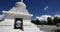 4k busy traffic & pedestrian through white stupa in Lhasa,Tibet.