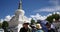 4k busy traffic & pedestrian through white stupa in Lhasa,Tibet.