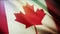 4k Canada National flag wrinkles seamless loop wind in Canadian sky background.