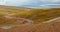 4k car driving on the meander road,distance lake namtso & mountain in tibet.