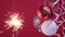 4k. Christmas mood. Sparkler Bright burning Christmas light on red background