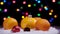 4K. Christmas orange tangerine fruit and red ball toys on the snow rotation