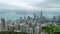 4K Cinematic zooming in fast time lapse footage of Victoria Harbour taken from The Peak in Hong Kong during cloudy day.