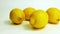 4k: A close up isolated slider view of group organic yellow lemons