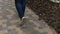 4K Close up shot of feet walking along paving stone blocks.