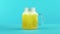 4K close-up shot of fruit fizzy orange cold beverage drink pooring into glass jar mug blue background in studio