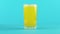 4K close-up shot of fruit fizzy orange cold beverage drink pooring into threaded glass blue background in studio