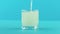 4K close-up shot of yellow lemon fizzy lemonade soda cold beverage drink pooring into low glass with facets blue