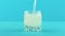 4K close-up shot of yellow lemon fizzy lemonade soda cold beverage drink pooring into small beautiful glass blue