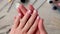 4k Closeup elegant pastel natural modern design manicure. Female hands. Gel nails. Nude manicure. Beige color. Skin care