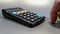 4K Closeup view of Hand pressing calculator. Businessman, accountants, investors, entrepreneurs making decision and saving finance