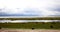 4k clouds mass rolling over Tibet lake namtso,herdsman tent,a group of cow.