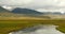 4k clouds mass rolling over Tibet mountain,River flowing the prairie.