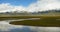 4k clouds mass rolling over Tibet mountain,River flowing the prairie.