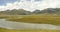 4k clouds mass rolling over Tibet mountain,River flowing through the prairie.