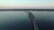 4K Compilation Video. Flight over road in frozen lake in early spring on sunset, aerial view