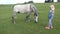 4K Cowboy Farmer Child Pasturing Horse in Mountains, Girl Playing with Animals