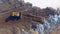 4K. Dozer, bulldozer working at the garbage dump. Directly from above. Aerial shot.