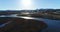 4K drone aerial over a river toward Thjodfell mountain at sunset in North Iceland