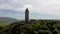 4k drone footage of the National Wallace Monument overlooking the city of Stirling in Scotland