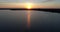 4K drone sunrise lake crane up