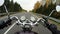 4K. Fast motorcycle riding on the beautiful forested road, wide point of view of rider. Classic cruiser/chopper forever!