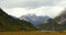 4k flag in wind on the prairie,clouds mass rolling over snow mountains in tibet.