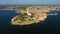 4K. Flight over beautiful Rovinj at sunset. Evening aerial panorama of the old town of Rovinj and islands, Istria, Croatia