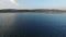 4K. Flight over fishing place with floats at sunset in the sea. Birds are sitting on the floats. Aerial panoramic view.