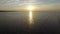 4K. Flight over fishing place with floats at sunset in the sea. Birds are sitting on the floats. Aerial view.