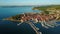 4K. Flight over old town Izola in Slovenia, aerial panoramic view with marina at sunset. Adriatic sea coast. Peninsula of Istria